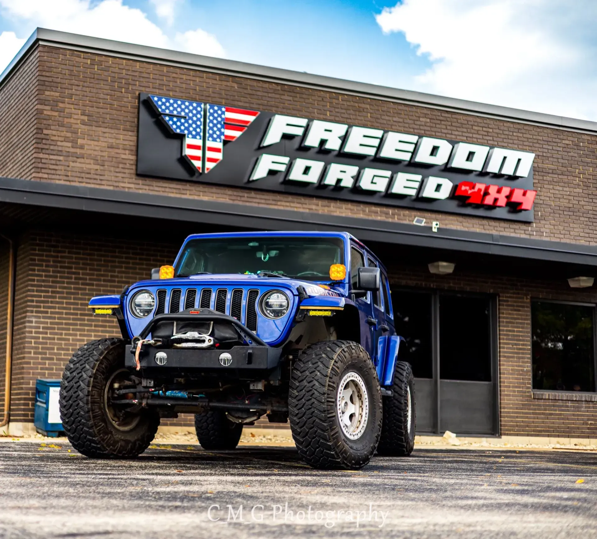 Blue Jeep Wrangler Parked in Front of Shop | Freedom Forged Auto Repair