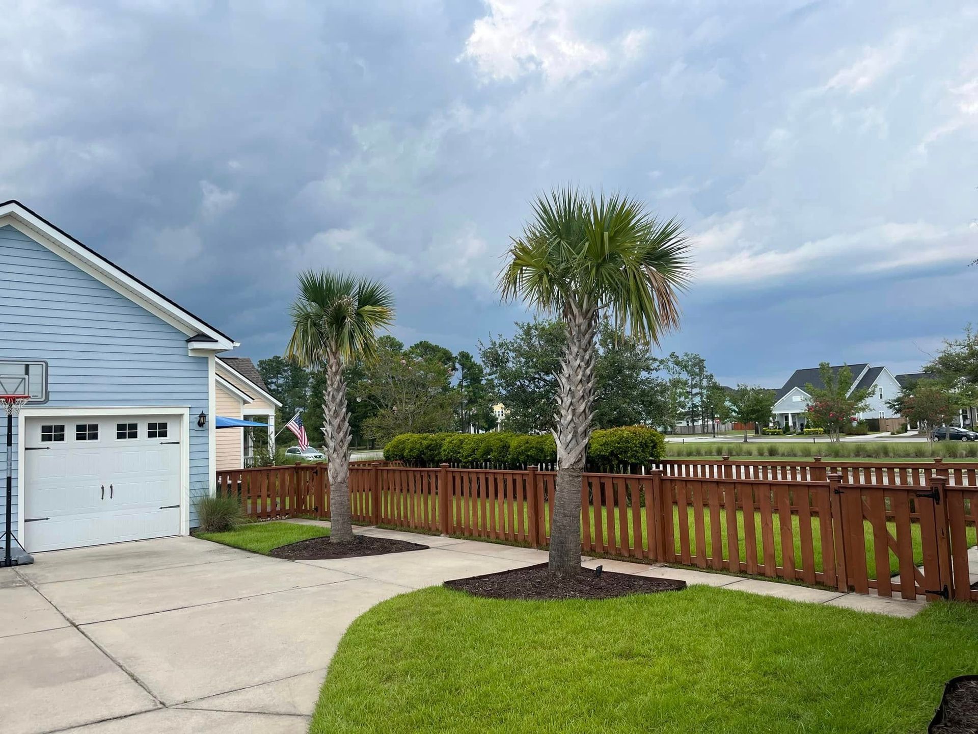 A house with a basketball hoop in front of it
