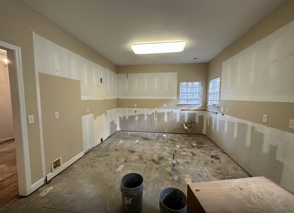 Kitchen stripped to drywall and prepped for renovation with visible plumbing and electrical — home remodeling Chattanooga.