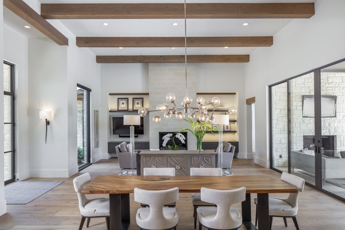 A dining room with a large wooden table
