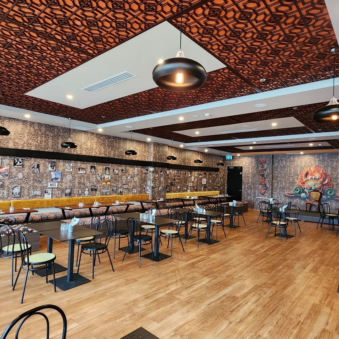 Lighting Fixtures in a Restaurant with Chairs and Tables — Professional Electrical & Data Pty Ltd in Bonner, ACT