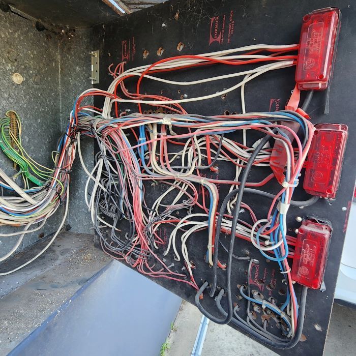 A Bunch of Wires Are Connected to a Black Board — Professional Electrical & Data Pty Ltd in Bonner, ACT