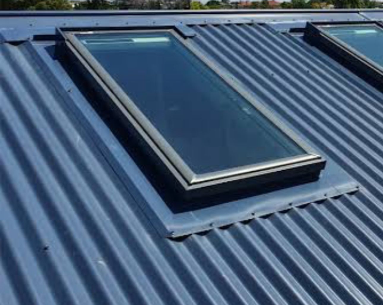 An Empty Room With Hardwood Floors and a Skylight in the Ceiling — CBR Maintenance In Curtin, ATC