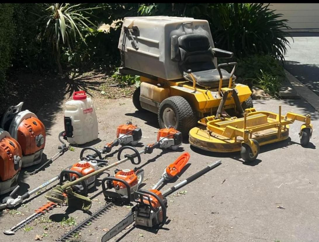 A Yellow Lawn Mower Is Parked Next to A Bunch of Tools — CBR Maintenance In Curtin, ATC