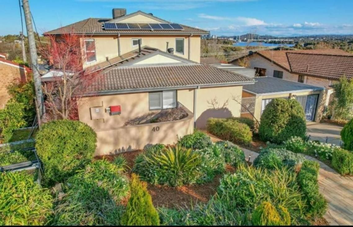 An Aerial View of A Large House Surrounded by Trees and Bushes — CBR Maintenance In Curtin, ATC