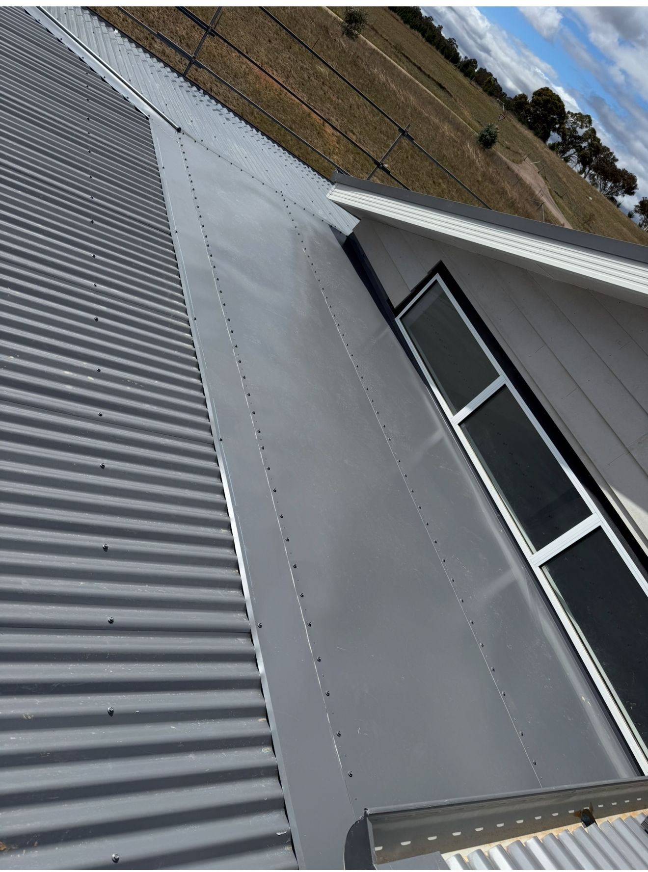 A Close Up of a Grey Colorbond Roof — CBR Maintenance In Gungahlin, ATC