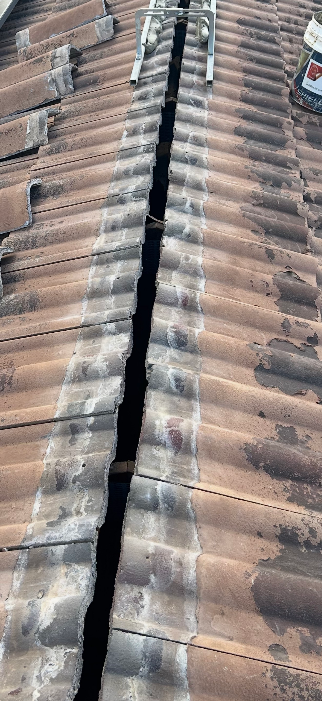 A Close Up a roof line that is old and damaged — CBR Maintenance In Curtin, ATC