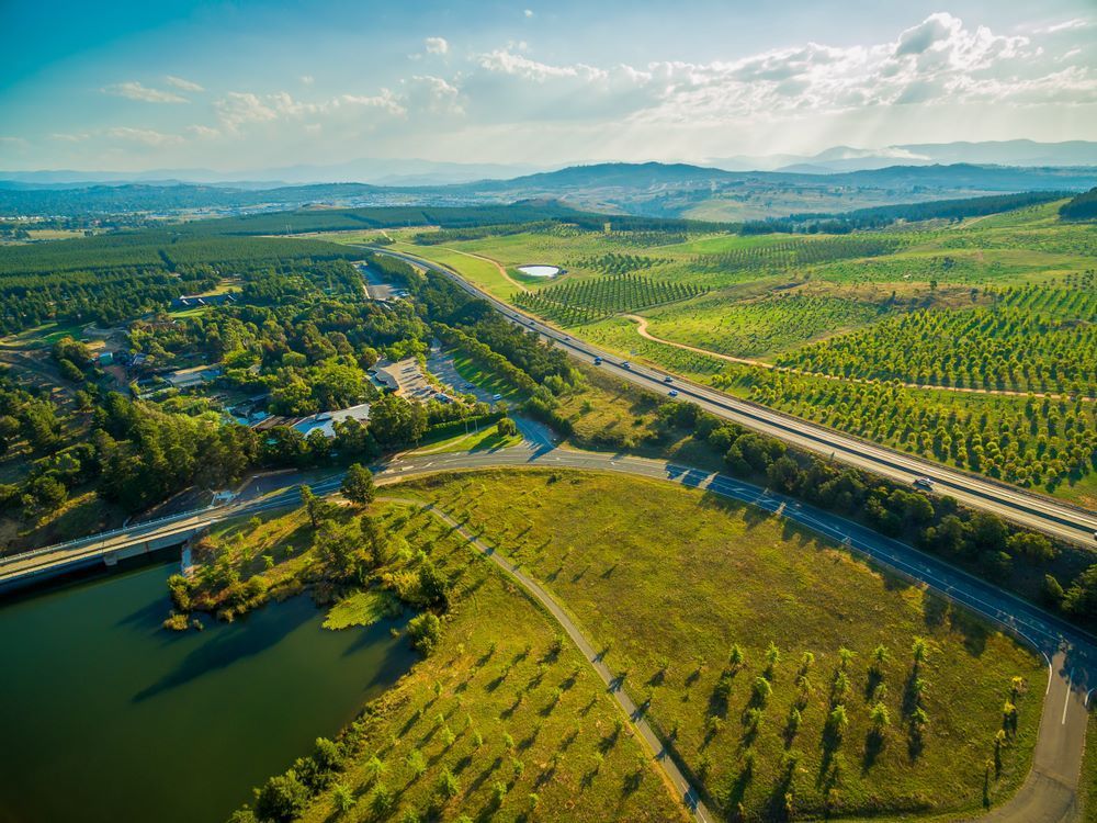 An Aerial View of a Highway Surrounded by Trees and Fields — CBR Maintenance In Tuggeranong, ATC