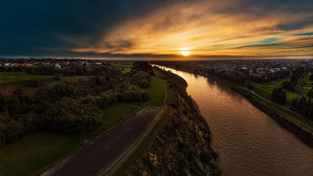 An Aerial View of a River at Sunset With a City in the Background — CBR Maintenance In Woden, ATC