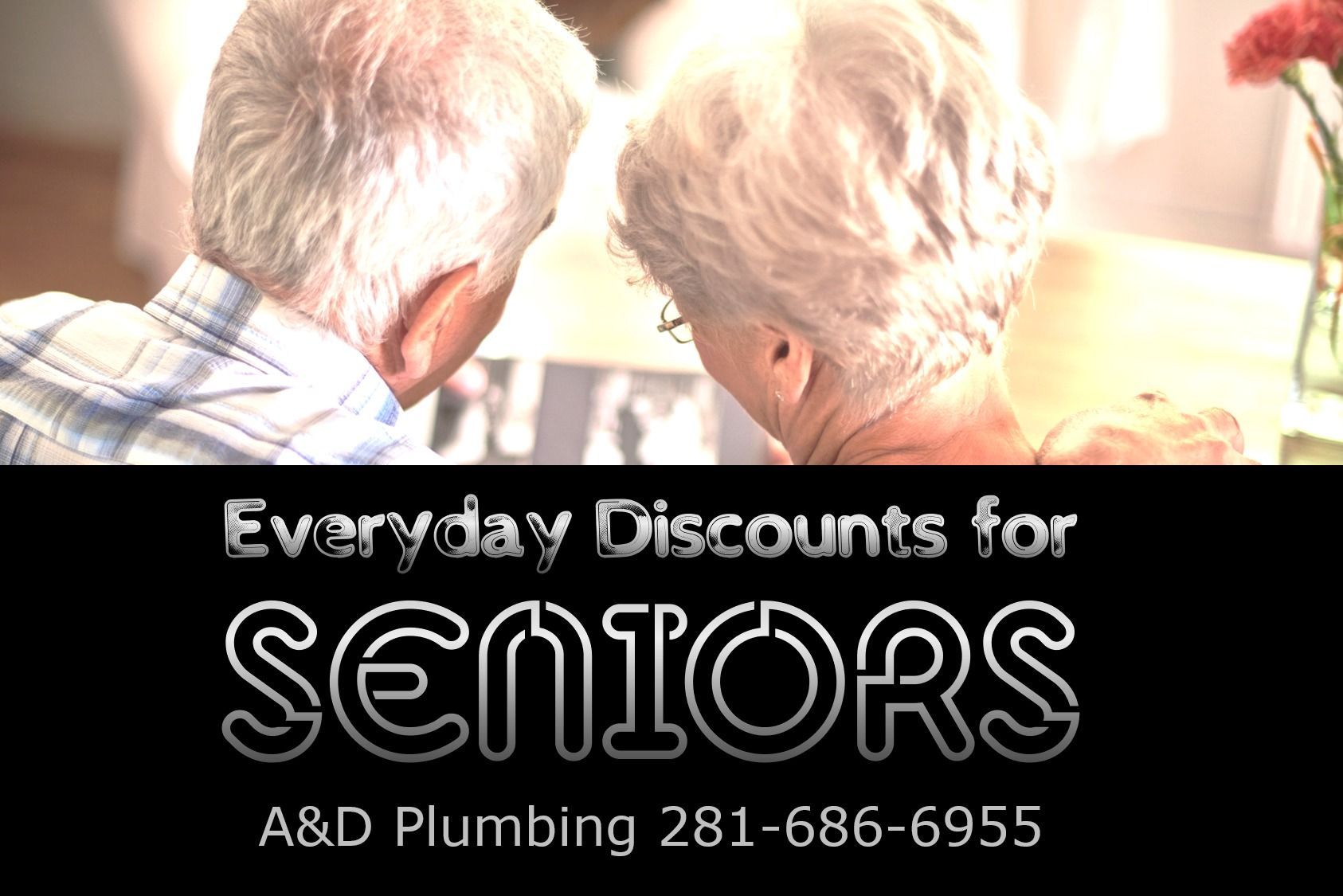 Senior couple looking at a photo. Ad for A&D Plumbing, offering everyday discounts for seniors. Phone number included.