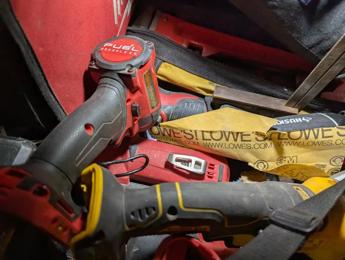 A bunch of tools are sitting on top of each other in a pile.
