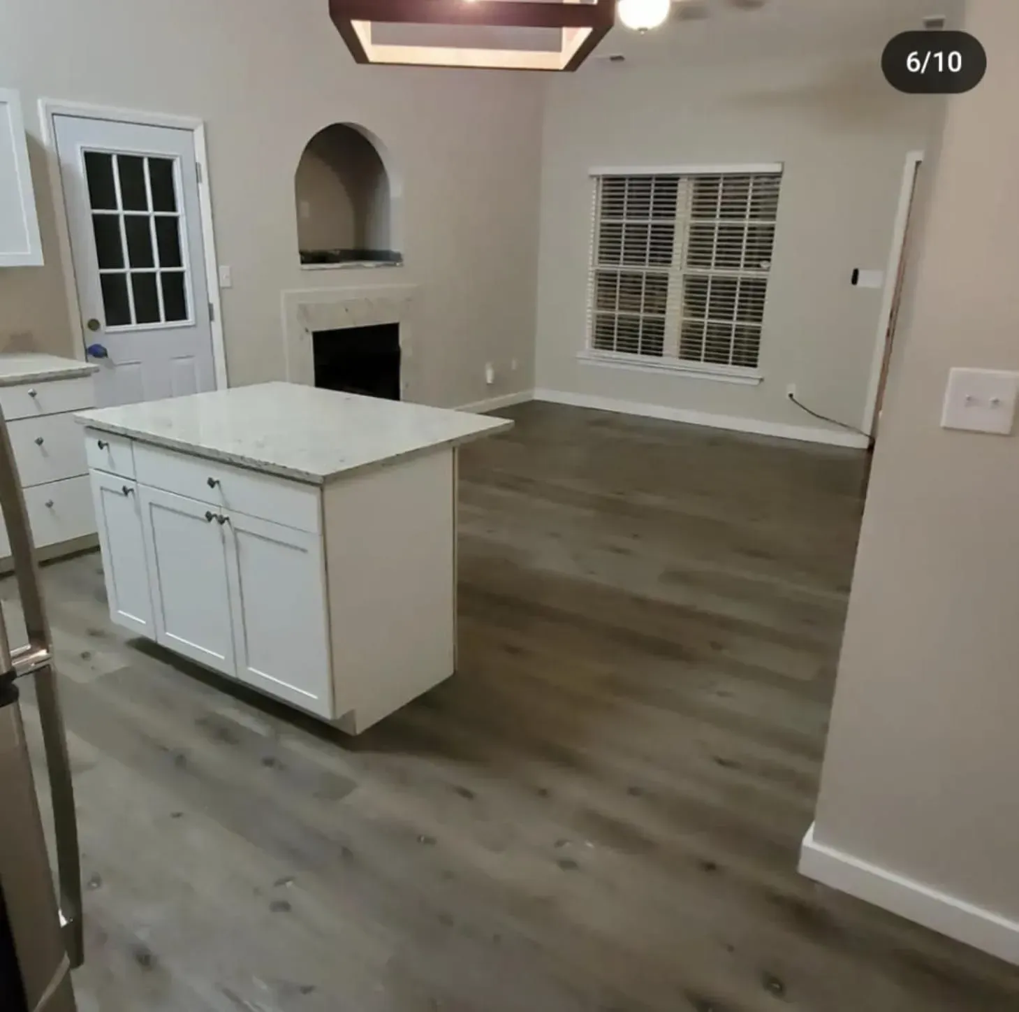 A kitchen with a large island in the middle of it