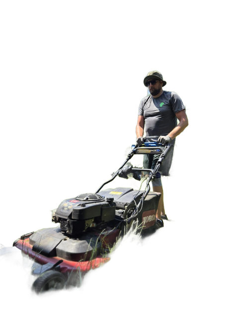 Man mowing grass with a lawnmower, wearing sunglasses and a hat.