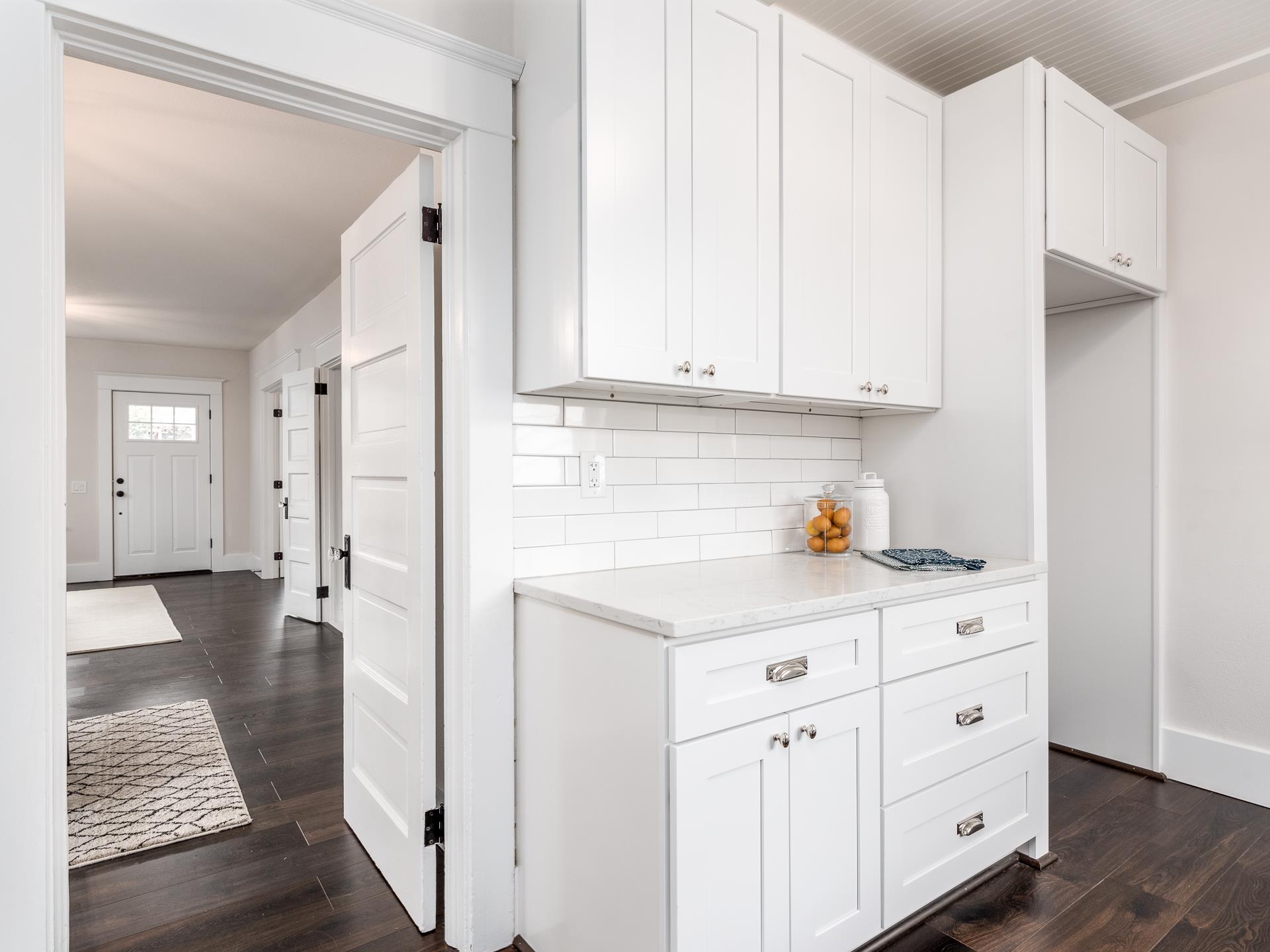 Picture of a kitchen counter and a hallway.