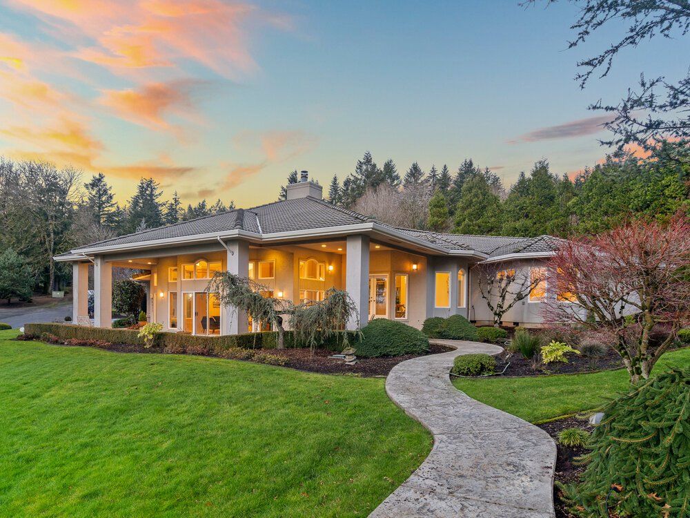 Photo of a walking path leading up to a single story home.