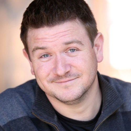 a group of horses and jockeys are racing on a track