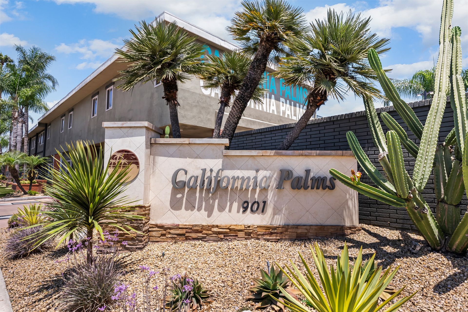 monument sign and palm trees
