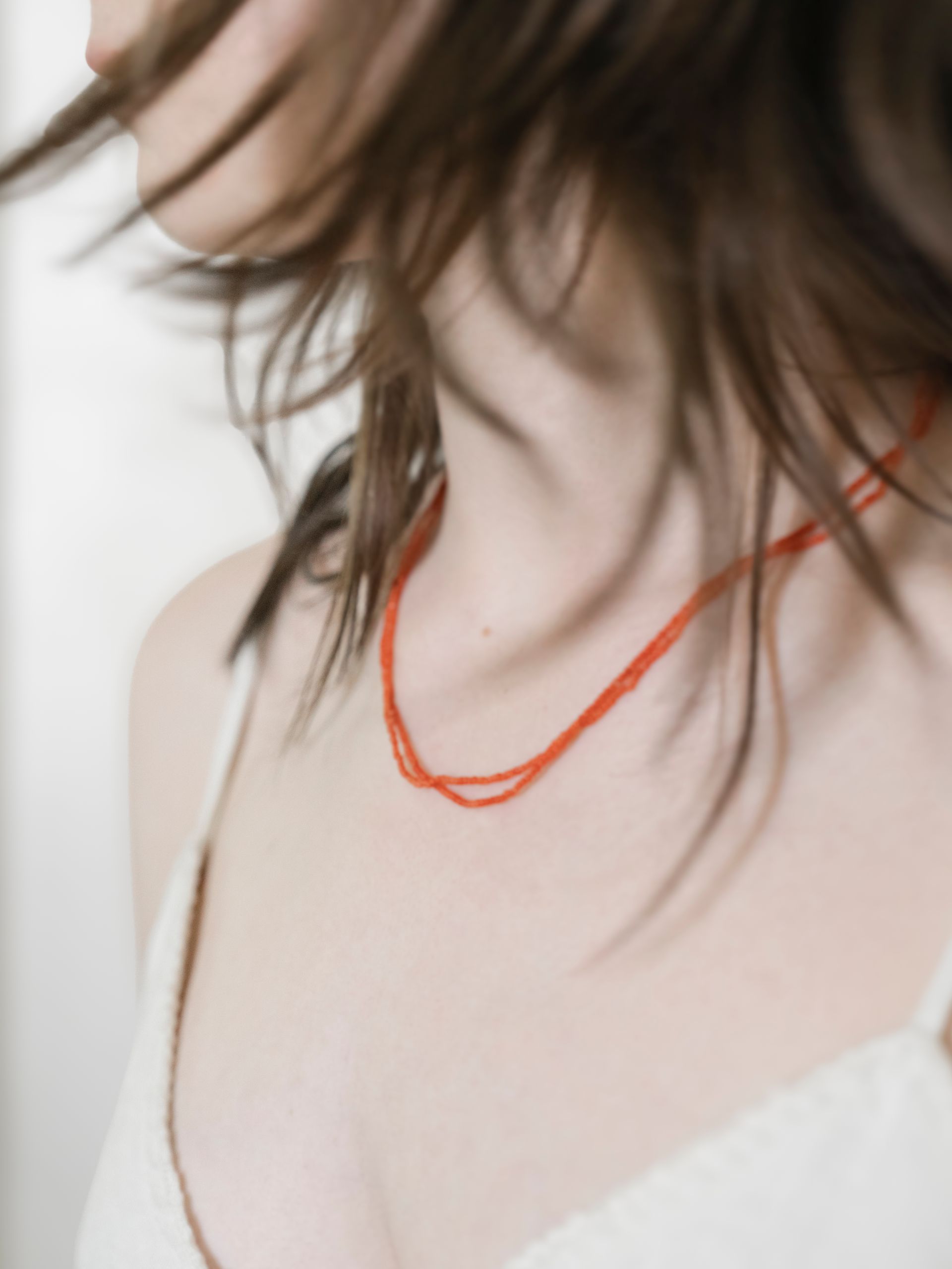 A picture of a cowboy boot is sitting on a table next to a disco ball and cactus.