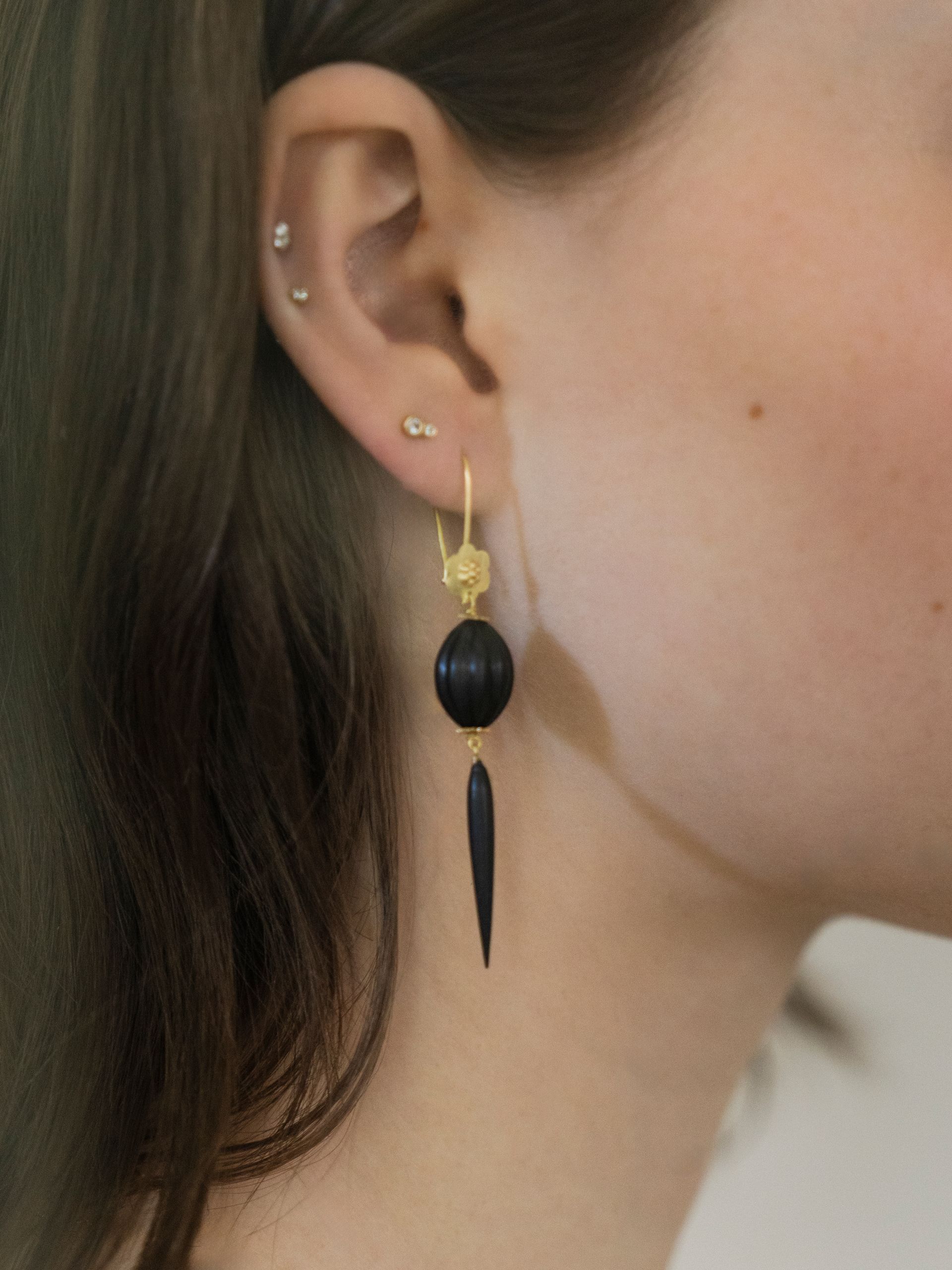 A bathroom with dolly parton wallpaper on the wall and a sink.