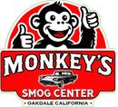 Monkey's Smog Center logo: smiling monkey giving thumbs up, red and white text, classic car, Oakdale California.