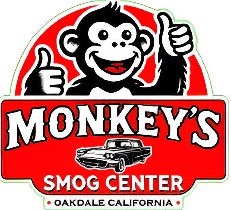 Monkey's Smog Center logo: smiling monkey giving thumbs up, red and white text, classic car, Oakdale California.