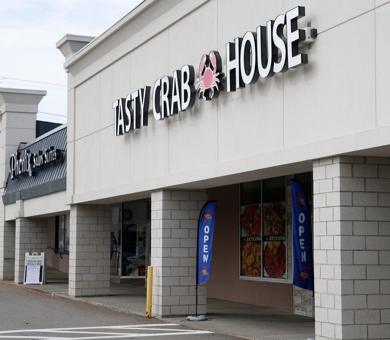 Side view of Tasty Crab House, Poughkeepsie, front door's sign