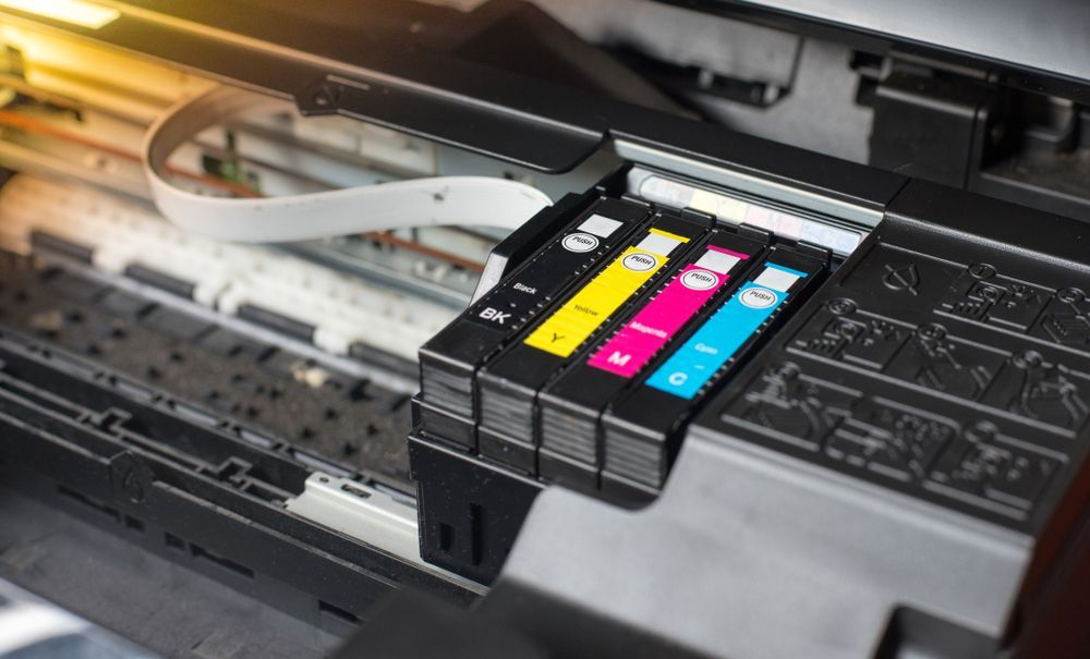 A Close up Of Three Ink Cartridges in A Printer — Imsprint in Cardiff, NSW