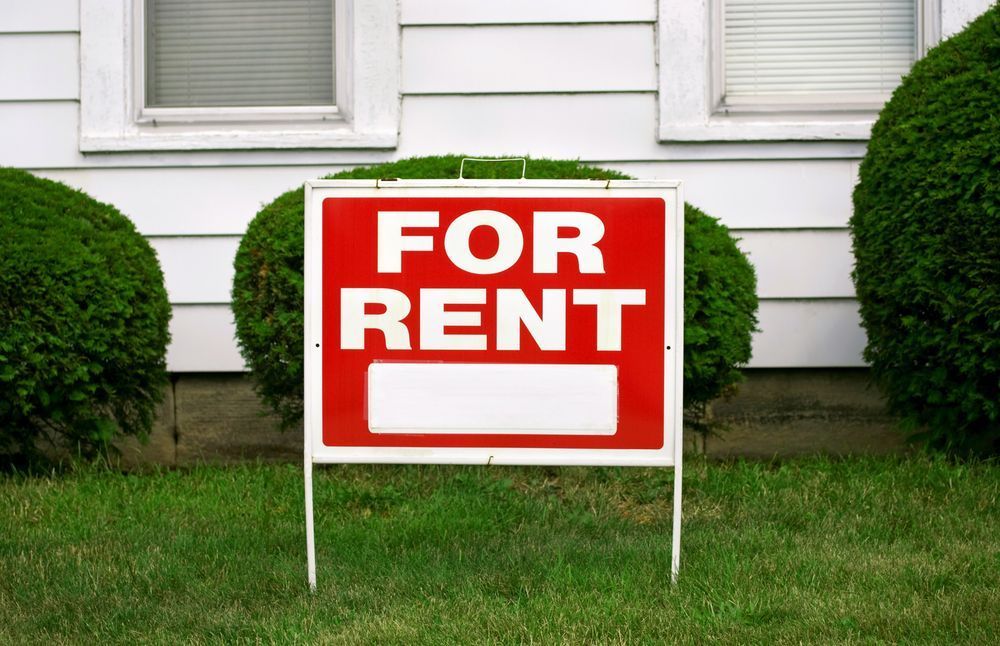 A Red and White for Rent Sign in Front of A House — Imsprint in East Maitland, NSW
