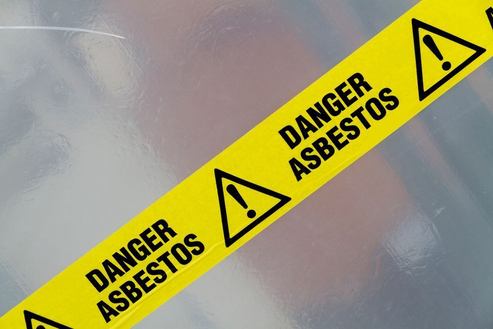 A Yellow Warning Tape that Says Danger Asbestos on It — Imsprint in East Maitland, NSW