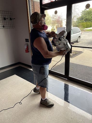 Office Cleaning Company — Staff Cleaning Floor using Mop in Wentzville, MO