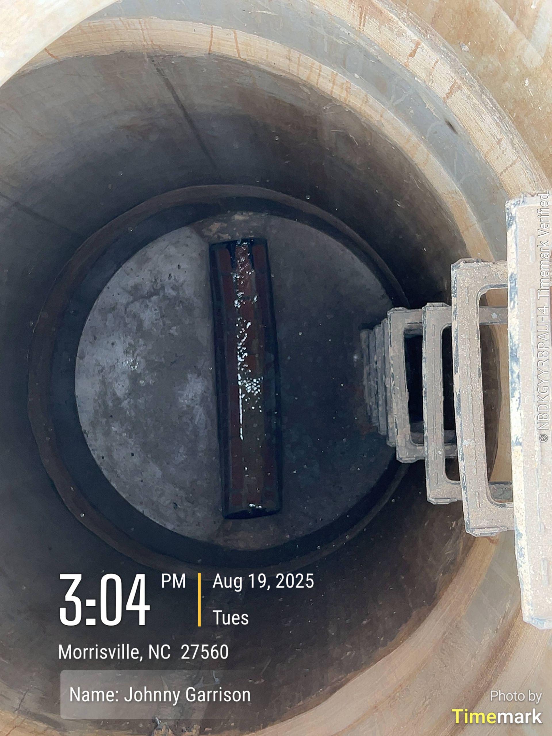 Inside a cylindrical manhole: a pipe, ladder, and timestamp showing August 19, 2025, 3:04 PM, and location.