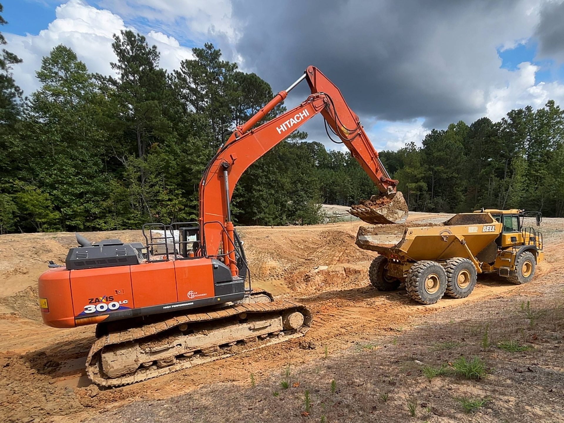 A large house with two garages and a driveway in front of it.