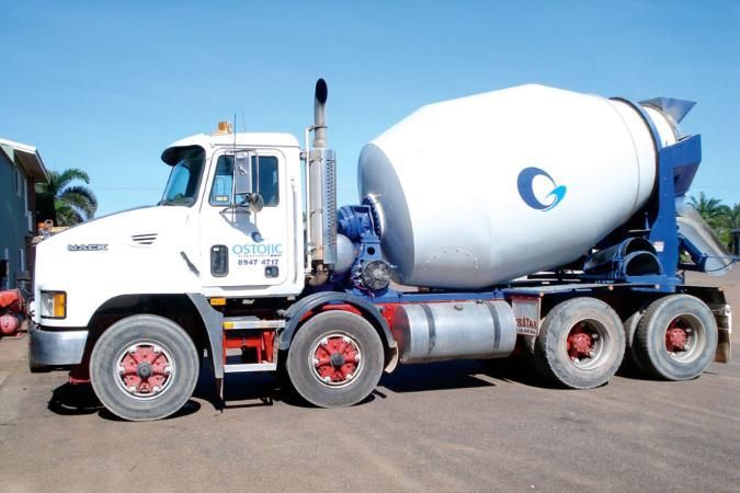 White Cement Mixer Truck Parked Outdoors on a Sunny Day — Ostojic Group in Berrimah, NT