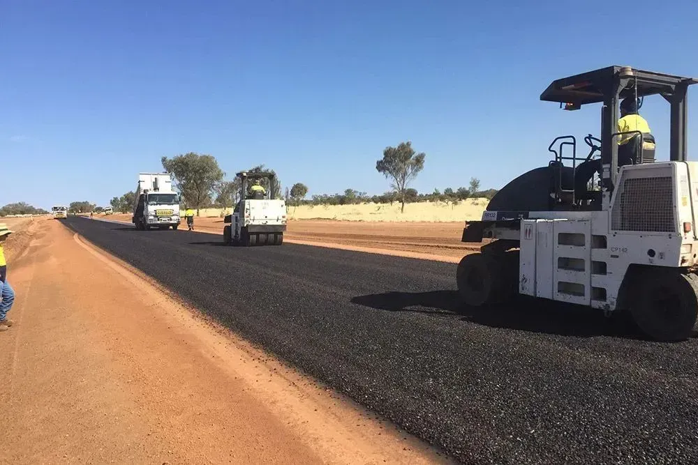 A Group of Construction Workers Are Working on a Road — Ostojic Group in Berrimah, NT