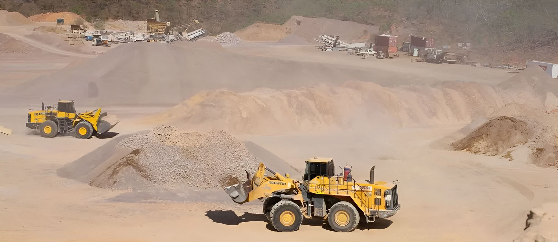 A dirt quarry with a yellow truck — Ostojic Group in Berrimah, NT