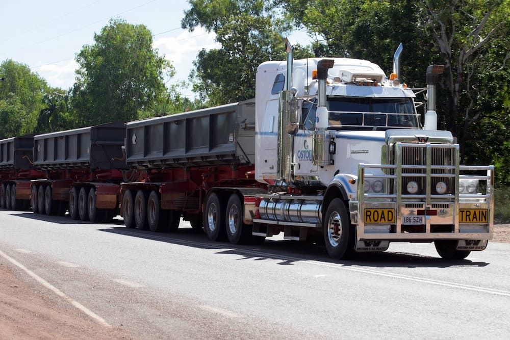 A Large Semi Truck With a License Plate That Says Road — Ostojic Group in Berrimah, NT 