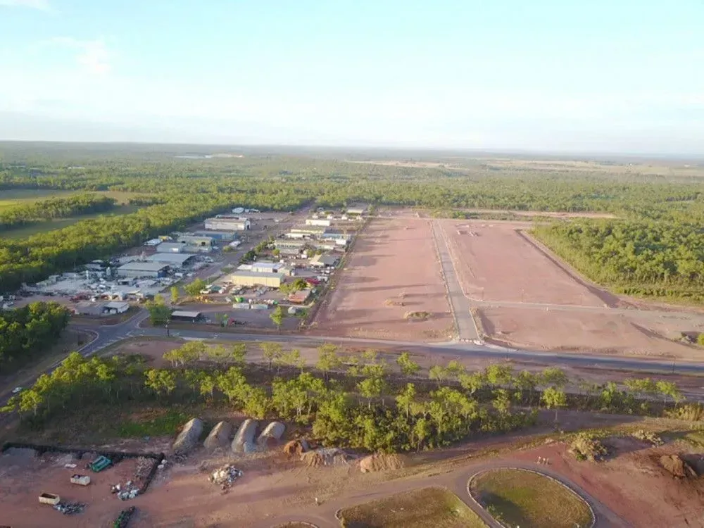 An Aerial View of a Small Town Surrounded by Trees and Dirt — Ostojic Group in Berrimah, NT