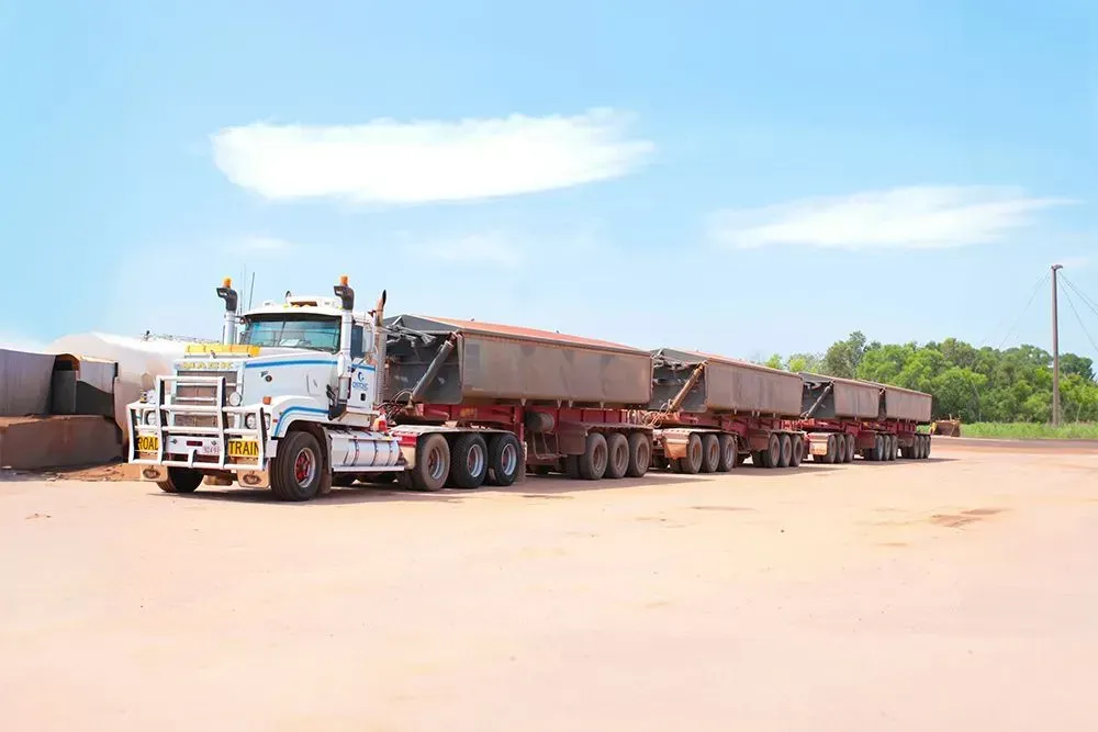 A Large Semi Truck is Parked in a Dirt Lot — Ostojic Group in Berrimah, NT