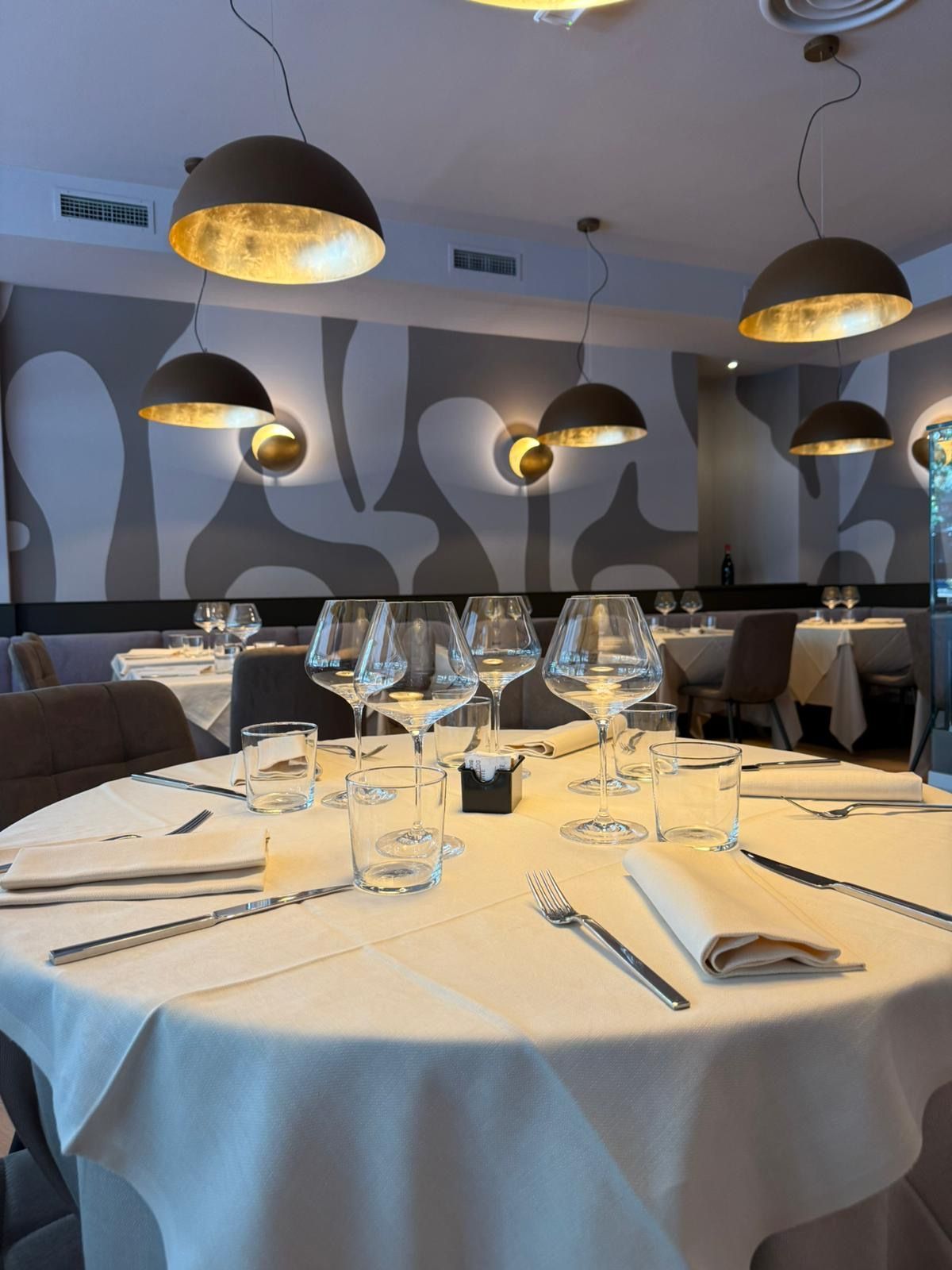A person is pouring ice cream into a glass of coffee