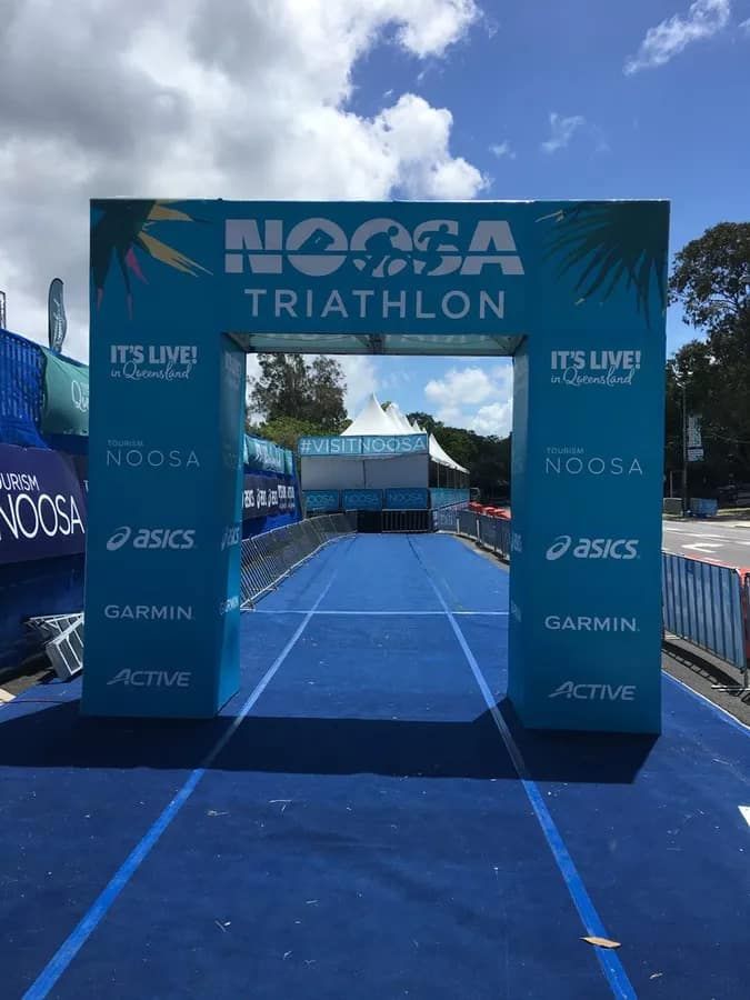 The Entrance To The Noosa Triathlon Is A Blue Archway — Party Bins Pty Ltd In Landsborough, QLD