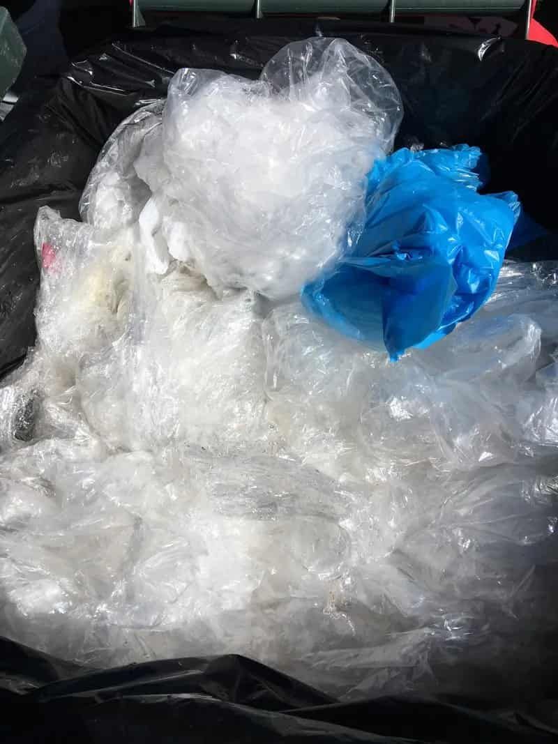 A Pile Of Plastic Bags Sitting On Top Of A Trash Can — Party Bins Pty Ltd In Landsborough, QLD