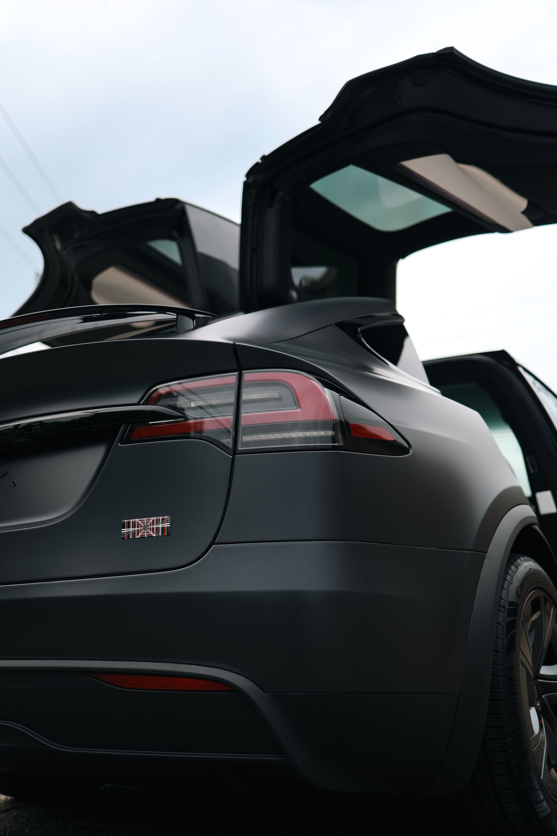 A close up of the hood of a black car