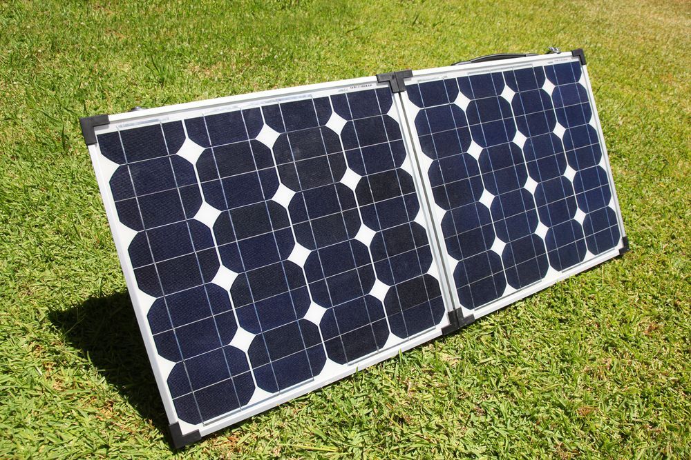 Folding Solar Panel on Green Grass — OzEnergi in Maroochydore, QLD