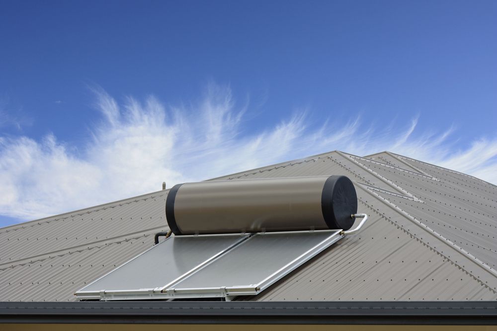 Solar Water Heater on a Gray Metal Roof — OzEnergi in Maryborough, QLD