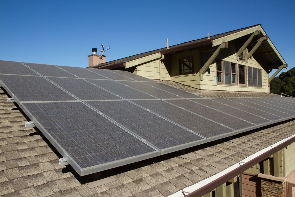 Solar Panels Installed on a Residential Roof Under a Clear — OzEnergi in Maryborough, QLD
