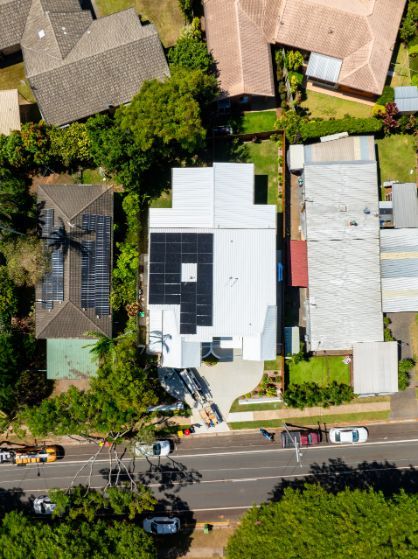Solar Panels with The Sun Shining in The Background — OzEnergi in Caloundra West, QLD