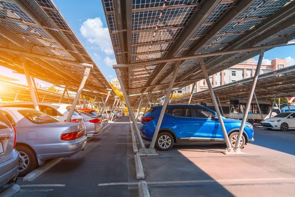 Solar-panel Covered Parking Lot With Parked Cars — OzEnergi in Gympie, QLD