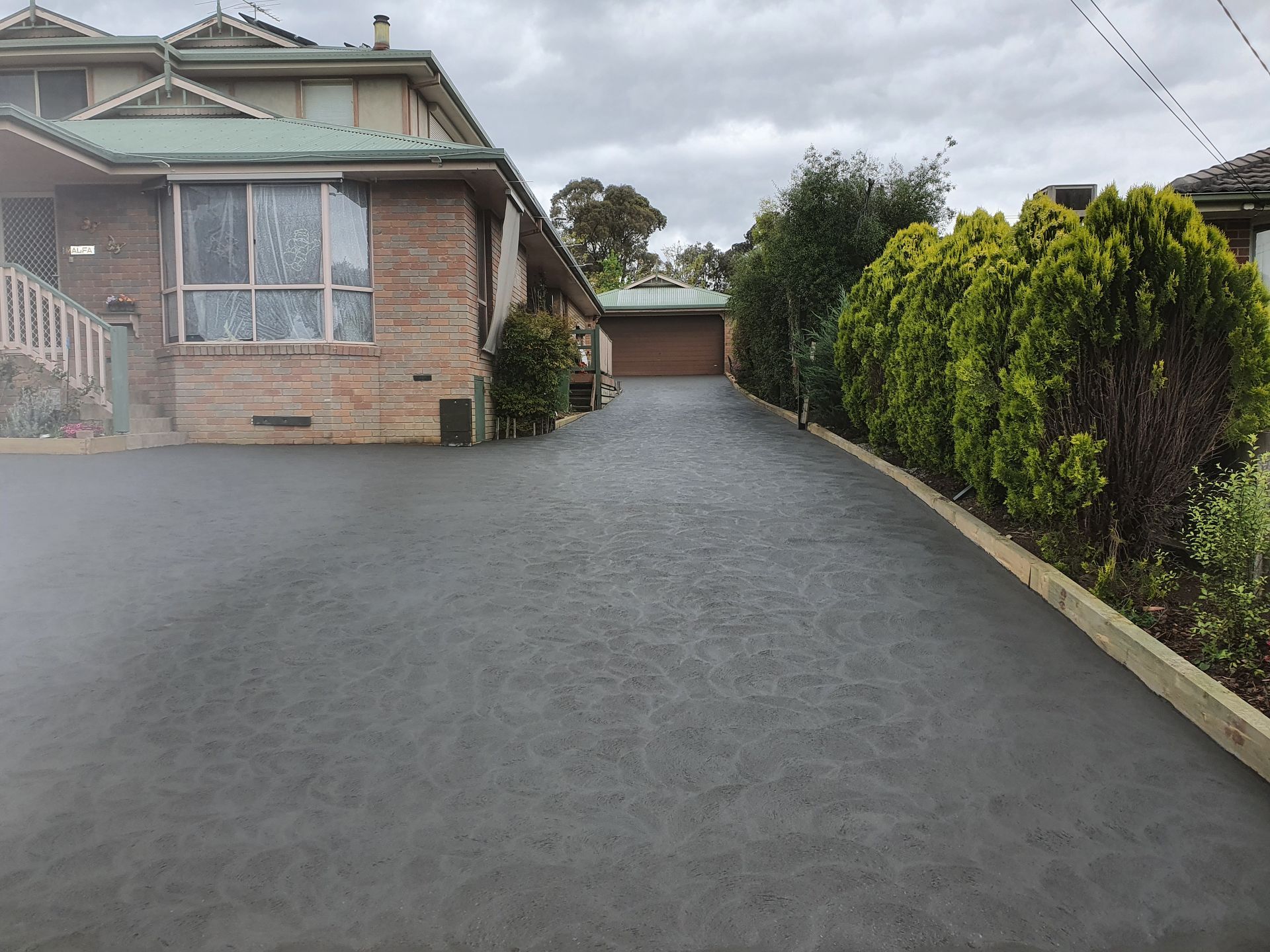A Large Wet Concrete Drive Way - Melbourne, VIC - Salcon Paving