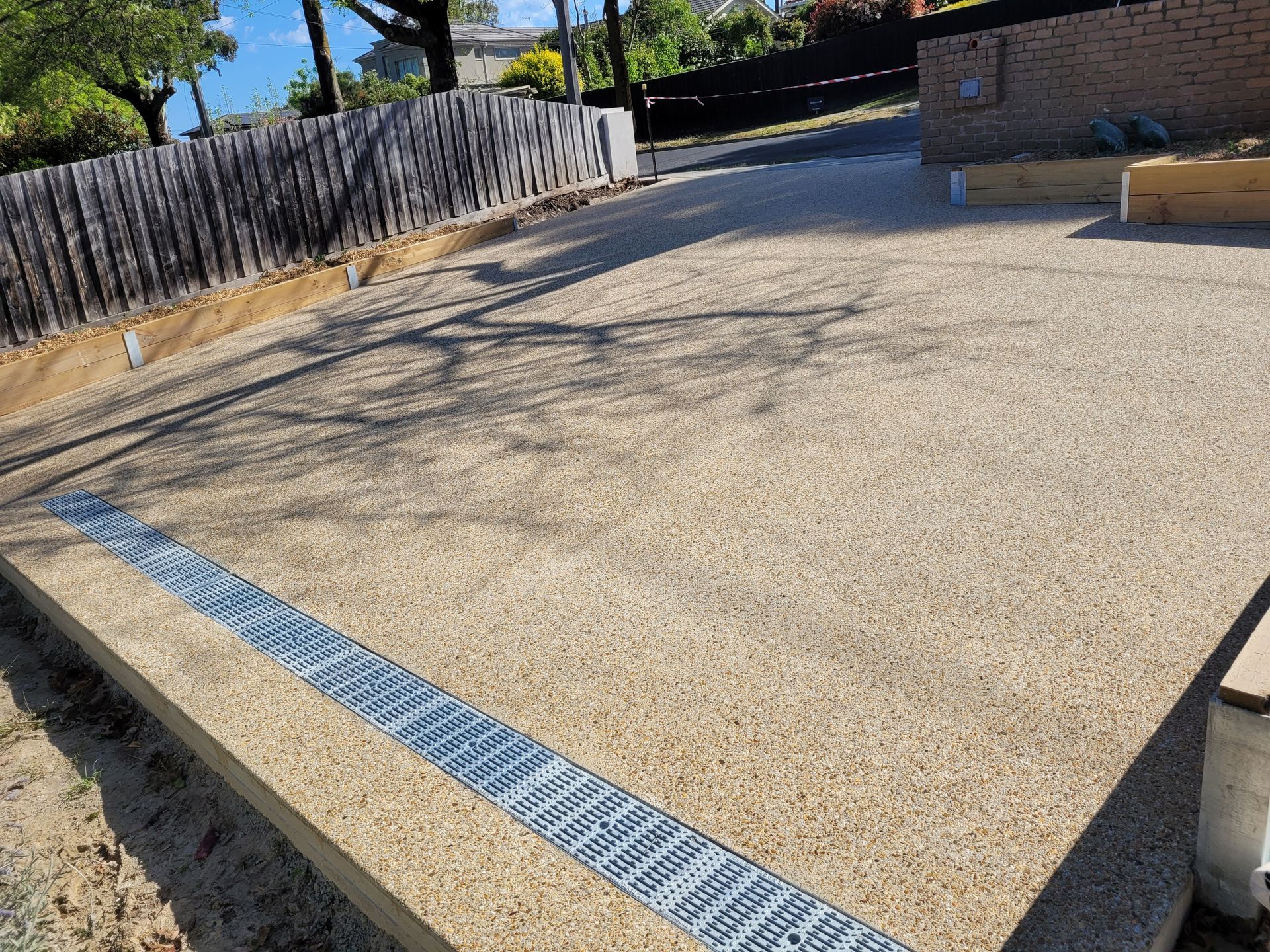 A Concrete Driveway with Drain - Melbourne, VIC - Salcon Paving