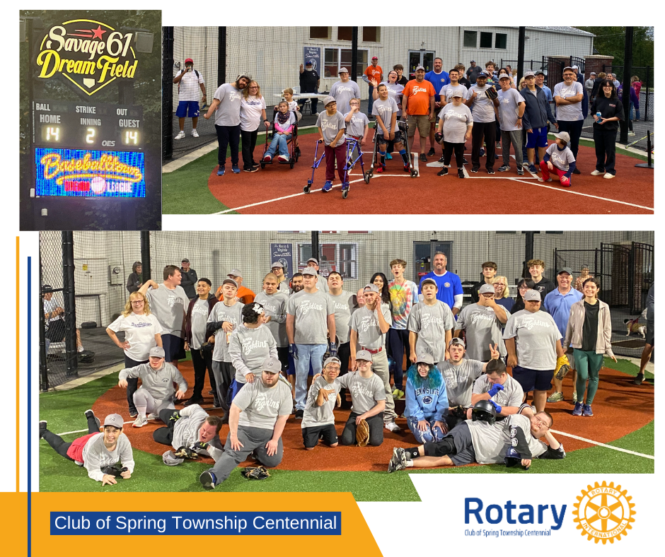 A group of people are posing for a picture on a baseball field.
